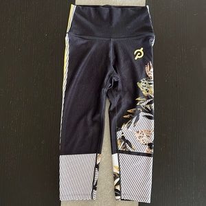 WITH Peloton capris. High rise. Good condition. Hard to find pattern.